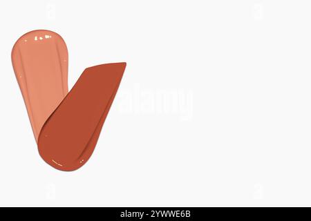 Composizione di strisci di fondazioni liquide in varie sfumature, tra cui toni chiari e scuri, isolati su uno sfondo chiaro. Foto Stock