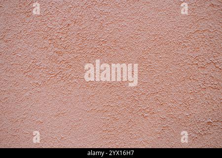 Sfondo di colore rosso pallido pastello granuloso e verniciato a spugna Foto Stock