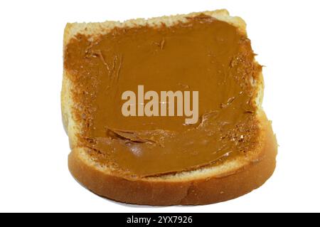 Pane tostato normale con spalmazione di burro per biscotti, spalmazione di biscotti caramellati, spalmazione liscia con una consistenza cremosa e ricca per pancake, brownie e tutto il des Foto Stock