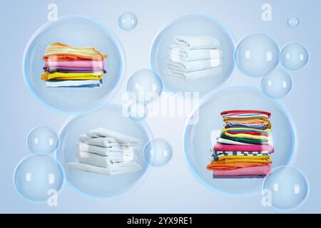 Diverse bolle di sapone con il bucato impilato all'interno e quelle vuote che fluttuano su sfondo azzurro Foto Stock