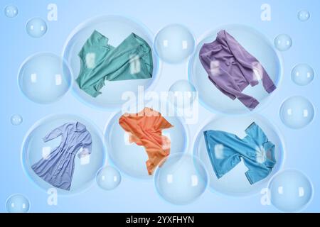 Diverse bolle di sapone con i vestiti all'interno e quelle vuote che fluttuano su sfondo azzurro. Giorno del bucato Foto Stock
