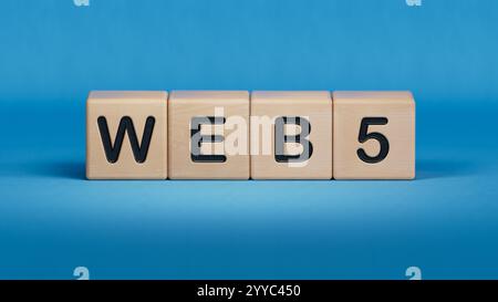 Blocco cubo in legno con Web 5 parole aziendali.primo piano di elementi in legno, concetto aziendale.rendering 3D su sfondo blu. Foto Stock