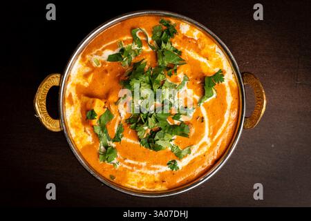 Burro di pollo in un piatto Foto Stock