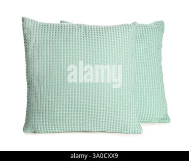 Cuscini di colore verde isolati su bianco Foto Stock