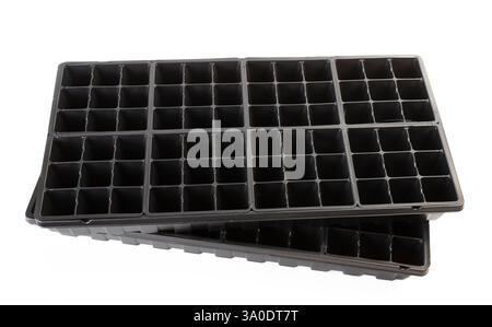 Contenitori commerciali per la coltivazione di materie plastiche per giovani piante. Foto Stock