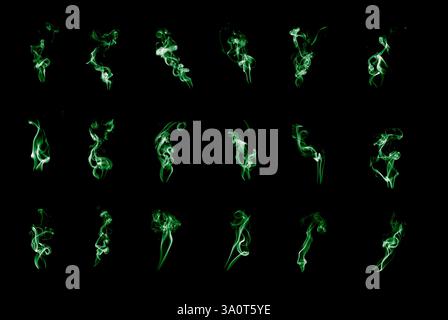 Nella foto vengono mostrate varie forme di fumo che salgono verso l'alto e creano motivi intricati. Le forme di fumo variano da sottili e delicate a spesse Foto Stock