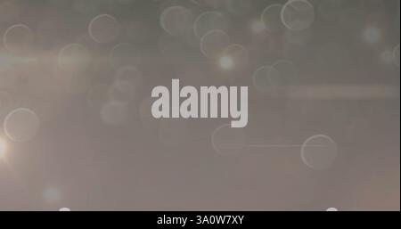 Immagine di macchie luminose e cerchi su sfondo grigio Foto Stock