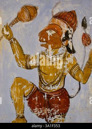 Un murale intemprato di Hanuman, il dio della scimmia, che tiene una mazza e un loto, simboleggia la forza e la devozione nella mitologia indù. Foto Stock