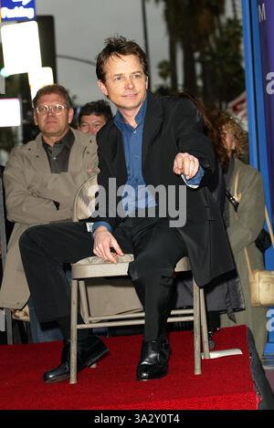 Dic. 16, 2002 - Hollywood, CALIFORNIA, STATI UNITI - K28055FB ..Michael J. Fox onorato con una stella su .Hollywood Walk of Fame. HOLLYWOOD, CA. .12/16/2002 .. FITZROY BARRETT / 2002 .Michael J. Fox(Immagine di credito: © Globo foto/ZUMAPRESS.com) Foto Stock
