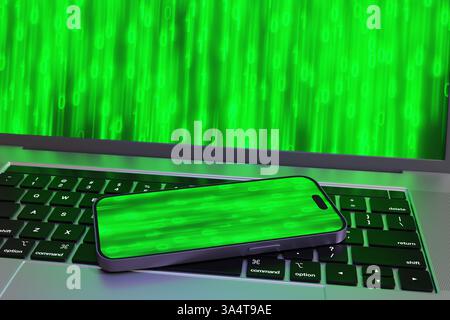 Telefono cellulare sul computer portatile, entrambi con numeri binari verdi luminosi che scorrono su schermi. Informatica, scambio di dati e portabilità dei dispositivi digitali Foto Stock