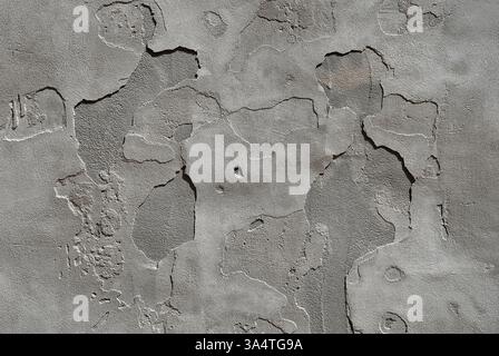 Sfondo della trama della parete in pietra di cemento armato grigio antico incrinato Foto Stock
