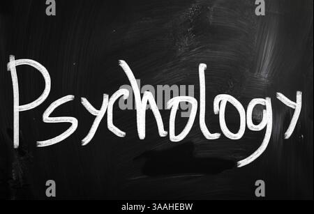 "Psicologia" scritta a mano con il bianco gesso su una lavagna Foto Stock