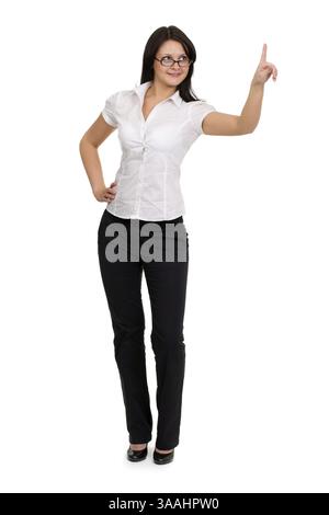 Brunette imprenditrice toccando virtual pad tasto trasparente con un dito Foto Stock