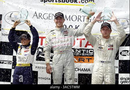 Il podio (da L a R): Danica Patrick (USA) Team Rahal, secondo; Michael Valiante (CDN) Lynx Racing, vincitore; Ryan Dalziel (GBR) Sierra Sierra Sierra Racing, terzo. . Toyota Atlantic Championship, RD12, Miami, Florida, Stati Uniti, 28 settembre 2003..IMMAGINE DIGITALE (immagine di credito: ©Sutton Motorsports/ZUMA Press) Foto Stock
