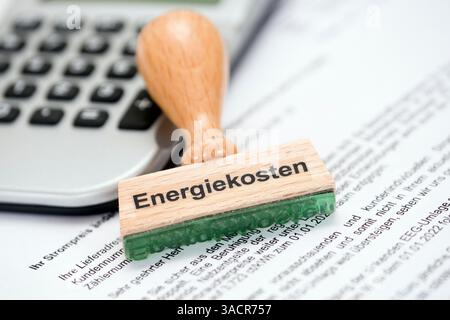 Timbrare con l'iscrizione costi energetici Foto Stock
