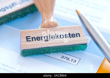 Timbrare con l'iscrizione costi energetici Foto Stock