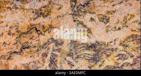 Primo piano dettagliato di texture in marmo grigio e arancione a chiocciola Foto Stock