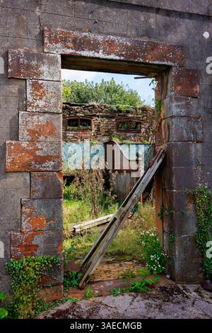Ex scuderie a Netherhall Estate a Maryport, Cumbria. La sala era una grande villa di campagna distrutta da un incendio nel 1976 e demolita nel 1979 Foto Stock