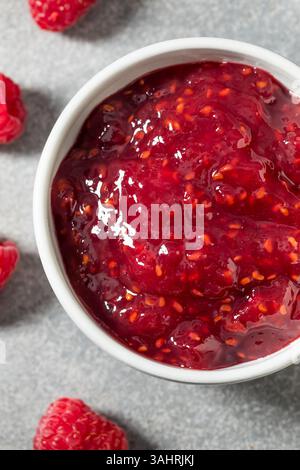 Sweet Organic Red Raspberry Preserves Jam in a Bowl Stock Photo