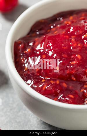Sweet Organic Red Raspberry Preserves Jam in a Bowl Stock Photo