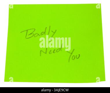 Scritto a mano ha bisogno di te in un libro verde Foto Stock