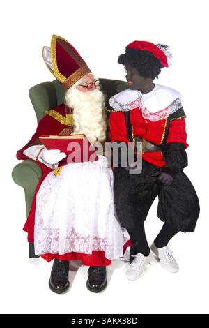 Sinterklaas e Nero Piet e libro rosso Foto Stock