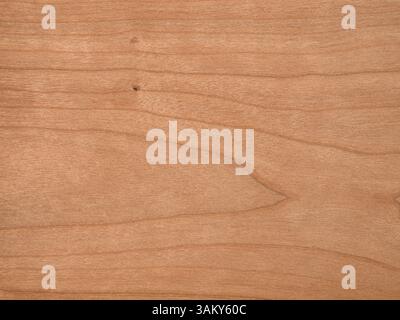 Sfumature calde e impiallacciatura di ciliegio americano a grana morbida su texture in legno Foto Stock