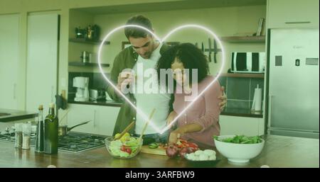Immagine dell'icona del cuore sulla felice cucina di coppia Foto Stock