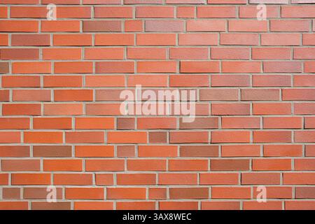 Sfondo da un muro fatto di mattoni di clinker arancione Foto Stock