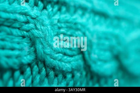 Primo piano del motivo e della trama del tessuto di lana intrecciata blu turchese Foto Stock