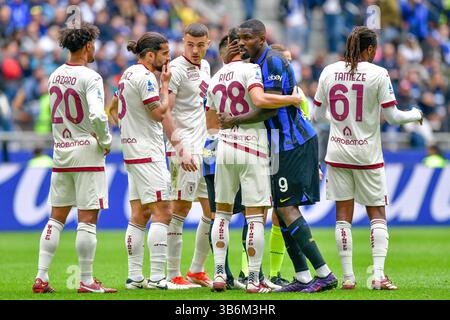 28 aprile 2024, Milano, null, Italia: Milano, Italia. 28 aprile 2024. Marcus Thuram (9) dell'Inter e Samuele Ricci (28) del Torino visto durante la partita di serie A tra Inter e Torino al Giuseppe Meazza di Milano. (Immagine di credito: © Gonzales Photo/Gonzales Photo tramite ZUMA Press) Foto Stock