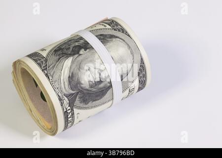Lotta contro la corruzione - il rotolo di fatture del dollaro con fascia in plastica sopra gli occhi Foto Stock