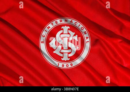 Pringsewu, Lampung 8 maggio 2025; logo Internacional della squadra di calcio brasiliana con sfondo a trama ondulata. Illustrazione 3D. Foto Stock
