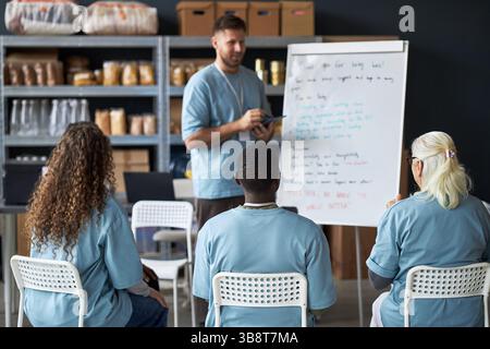 Insegnamento delle strategie aziendali durante la sessione di officina Foto Stock