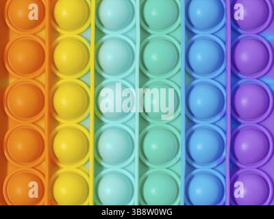 Primo piano estremo Popit. Popolare giocattolo in silicone colorato antistress per bambini. Concavità semplice. La polvere in questa immagine è stata pulita al 200% sc Foto Stock