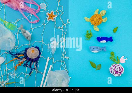 World Oceans Day, water pollution awareness, and environmental education visuals. Handmade crochet marine animals trapped in disposable plastic items Foto Stock