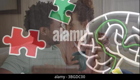 Immagine di un puzzle colorato in coppia con un tablet Foto Stock