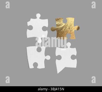 quattro puzzle, tre in bianco e nero e uno in oro metallizzato testurizzato, disposti su sfondo grigio. La contropartita visiva Foto Stock