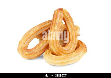 Un mucchio di tradizionali churros da dessert spagnoli, pasta fritta isolata su sfondo bianco. Cibo di strada, snack dolci, dessert fatti in casa. Foto Stock