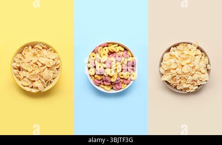 Set di ciotole con gustosi cereali da colazione su sfondo colorato, vista dall'alto Foto Stock