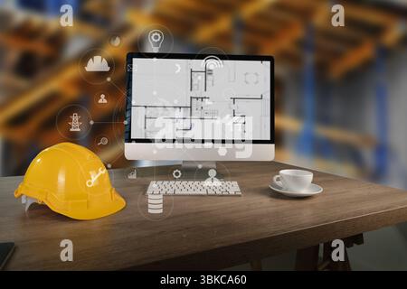 L'immagine 4,0 di un ingegnere architetto dell'industria mostra il casco da costruzione, il computer con la pianta dell'edificio e la tazza di caffè in cantiere con la scrivania in legno Foto Stock
