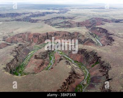 Il tortuoso canyon del fiume Owyhee alla luce della sera Foto Stock