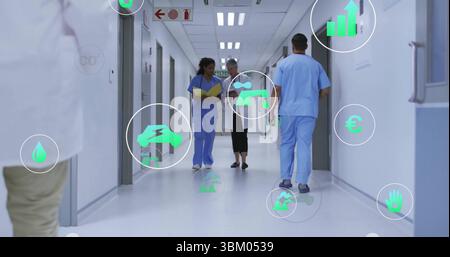 Infermiere che cammina in possesso di un file giallo che accompagna il paziente nella sala dell'ospedale, con icone di dati Foto Stock