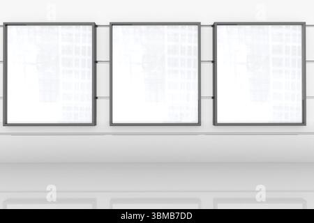 Tre telai quadrati vuoti sono appesi su una parete bianca nella galleria di design piatta, con pavimento riflettente Foto Stock