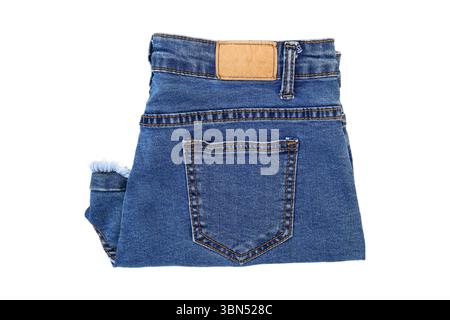 jeans pieghevoli isolati sul bianco. Foto Stock