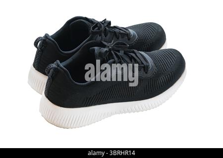 Sneaker alla moda blu intenso con lacci di scarpe isolate su sfondo bianco con percorso di ritaglio, vista ad angolo alto, primo piano, formato orizzontale Foto Stock