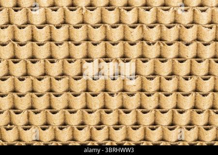 Vista ravvicinata del motivo del cartone ondulato come palo per graffi di gatto, sfondo Foto Stock