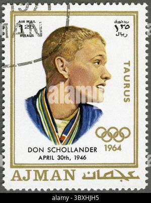 AJMAN - CIRCA 1970: Un francobollo stampato in Ajman mostra Donald Schollander (nato nel 1946), circa 1970 Foto Stock
