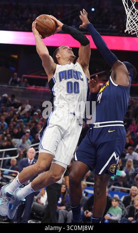 5 dicembre 2018 - Orlando, FL, USA - l'attaccante di Orlando Aaron Gordon (00) cerca di segnare l'attaccante di Denver Paul Millsap (4) durante la partita NBA dei Denver Nuggets all'Orlando Magic all'Amway Center mercoledì 5 dicembre 2018 a Orlando. (Immagine di credito: © Stephen M. Dowell/Orlando Sentinel/TNS via ZUMA Wire) Foto Stock