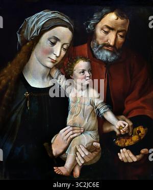 La Sacra famiglia 1525-1530, XVI secolo di Ambrosius Benson Ambrosius Benson (1495/1500-1550) Groeningemuseum, museo municipale, Bruges, Belgio, fiammingo, ( la Sacra famiglia in una scena domestica raffigurante Gesù come bambino tra le braccia di sua madre, Maria. Ha il braccio destro intorno al collo, e con la mano sinistra prende un noce da una ciotola che gli è stata offerta da Joseph. Foto Stock